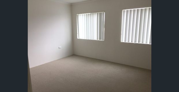 Sunny top floor unit - Photo 1