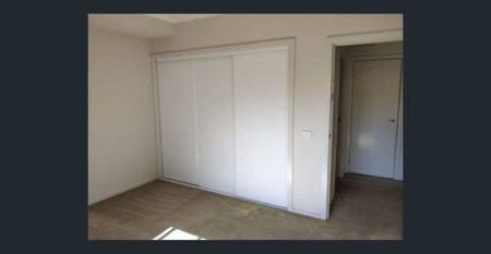 Modern Three-Bedroom Townhouse with Stylish Living in Prime North Melbourne Location - Photo 2