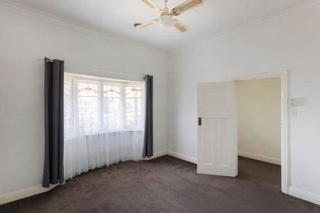 This beautifully presented, spacious three-bedroom home is ideally positioned in a highly sought-after location. - Photo 2