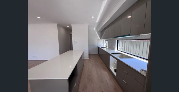 A stylish C.2025 home in a prime location – "A real people pleaser" - Photo 1