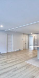 CONDO 5 1\2 FLAMBANT NEUF + 5 ÉLECTRO INCLUS + GRAND BALCON + STATIONNEMENT - Photo 3