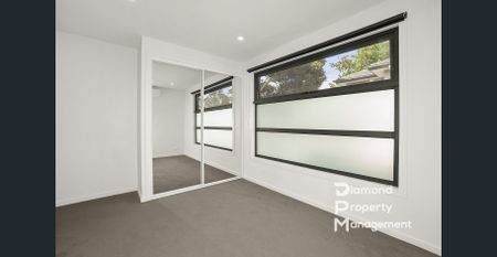 Luxurious Townhouse Living with Cutting-Edge Features - Photo 3