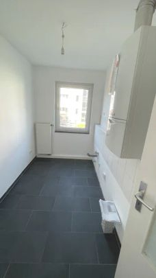 Schöne Erdgeschosswohnung mit Balkon - Foto 1