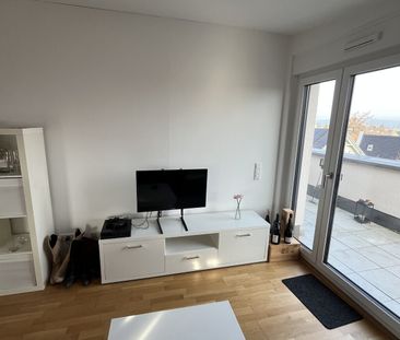 Moderne DG-Wohnung mit Dachterrasse, Balkon, TG-Platz & Weitblick i... - Photo 1