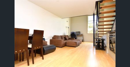 Furnished Loft-Style Living in the Heart of the CBD - Photo 2