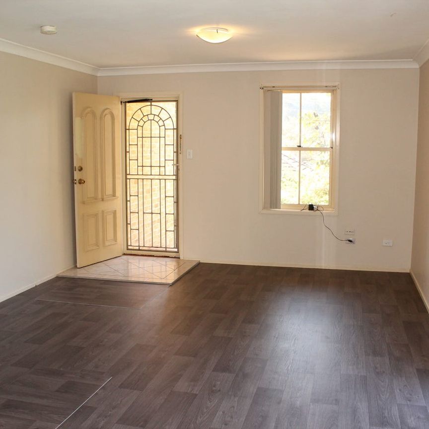 TOWNHOUSE WITH PERKS - Photo 1