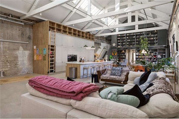 A unique 3,500 sq ft penthouse in a Grade II listed Victorian factory conversion, combining modern open-plan living with original industrial character. - Photo 1