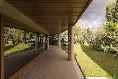 Elegante appartamento con giardino e piscina - Photo 4