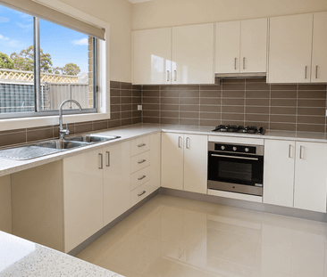 Spacious Three-Bedroom Townhouse in a Convenient Location - Photo 5