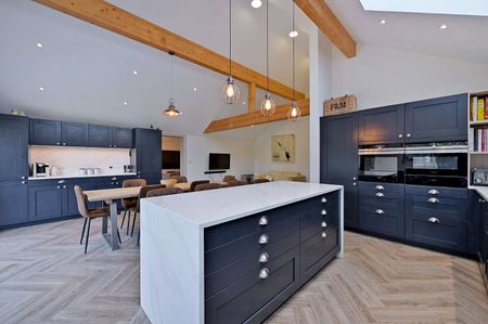 This versatile bungalow includes three bedrooms, principal with dressing room and ensuite, a stunning open plan kitchen with bi-fold doors, and a garden with a heated studio and WC. - Photo 2