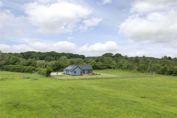 A highly energy efficient and stylish three bedroom single storey property with beautiful views, completed in 2023. - Photo 1