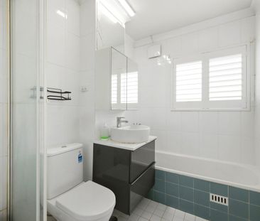 Spacious Top Floor Two-Bedroom Unit with Parking - Photo 5