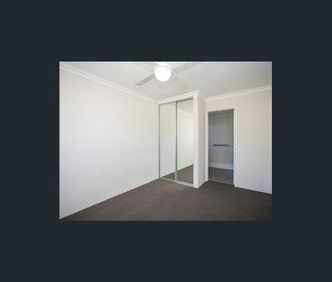 Coastal Comfort: Your Family Home Steps Away from the Beach! - Photo 1