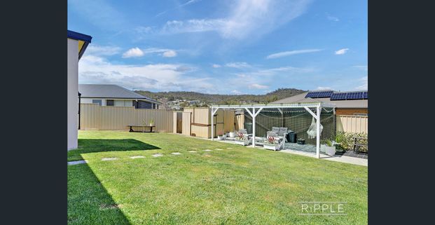 Renovated Family Home with Modern Finishes & Secure Yard - Photo 1