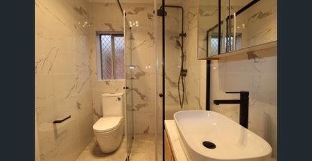 RENOVATED THREE BEDROOM BRICK HOME - Photo 5