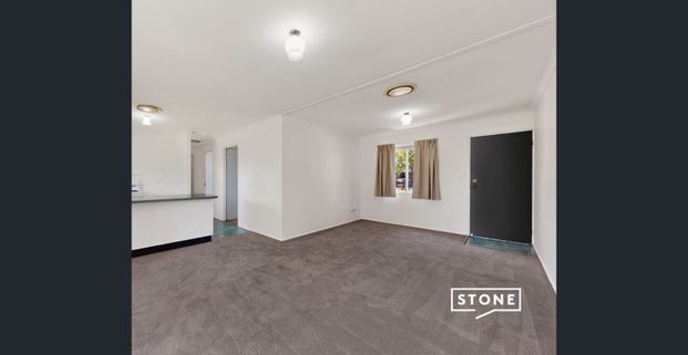 Low-Maintenance Living in a Quiet Complex with Pool – Perfect Location! - Photo 1