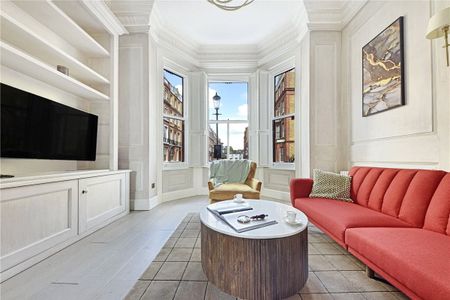 Immaculate and beautifully presented ground and lower ground floor duplex that has been refurbished to an exceptional standard combining the contemporary with the period features. Minimum Tenancy Length: 12 months EPC Rating C | Council Tax Band G - Photo 4