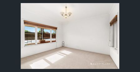 Charming Three-Bedroom Home with Sun-Filled Living - Photo 2