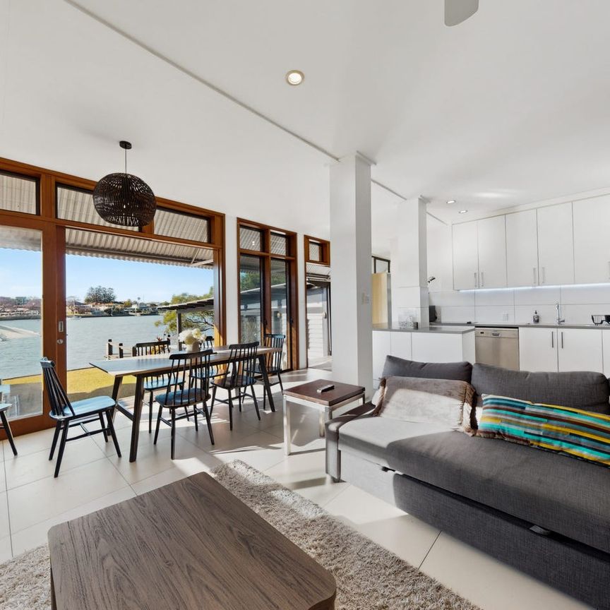 FULLY FURNISHED RIVERFRONT LIVING WITH CITY VIEWS, MULTIPLE LIVING OPTIONS & EXCEPTIONAL LIFESTYLE - Photo 1