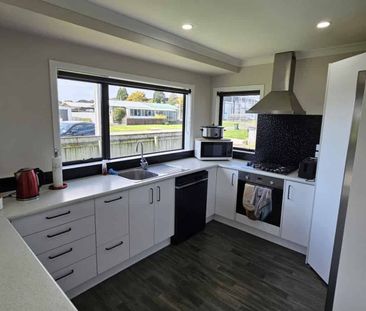 MODERN FAMILY HOME IN WAITARA - Photo 1