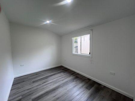 Spacious 3-Bedroom Home with Sunroom and Garden Shed - Photo 4