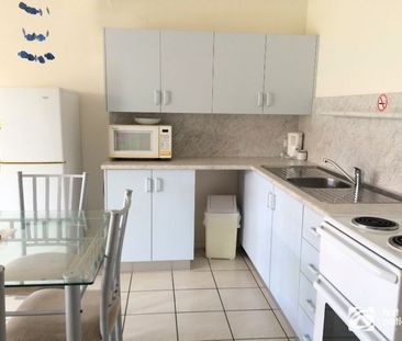 Furnished 2-bedroom unit with air conditioning and water included - Photo 6