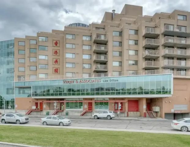 PANORAMIC VIEWS OF DOWNTOWN CALGARY FROM 5TH FLOOR | SUNNY SOUTH EXPOSURE | 504 - 128 2 Ave SE, Calgary - Photo 1