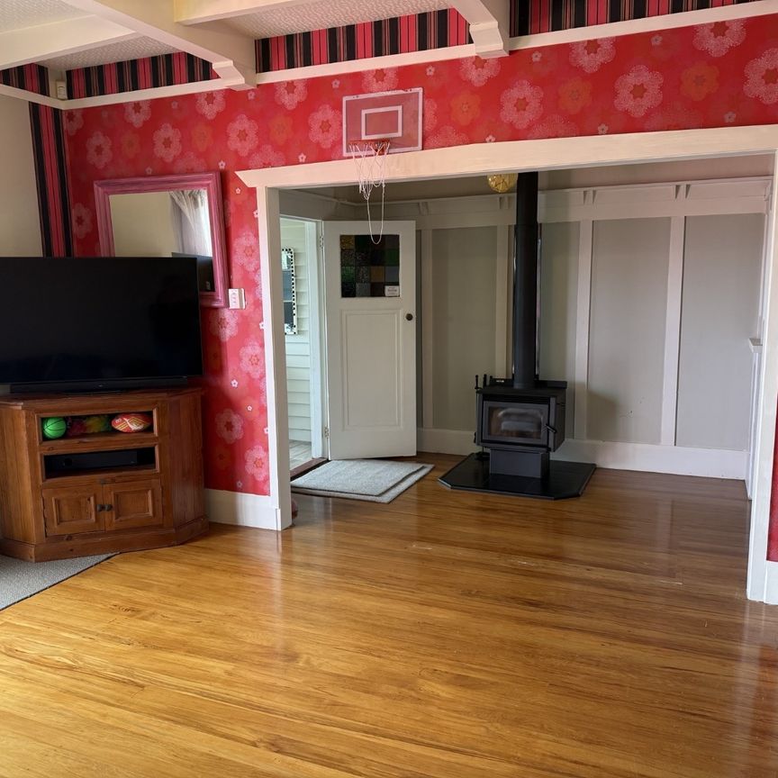 Step inside this beautifully presented 1930s three-bedroom, one-bathroom home, full of character and warmth. - Photo 1