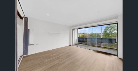 Stylish 2-Bedroom Unit with Balcony & Modern Comforts - Photo 2