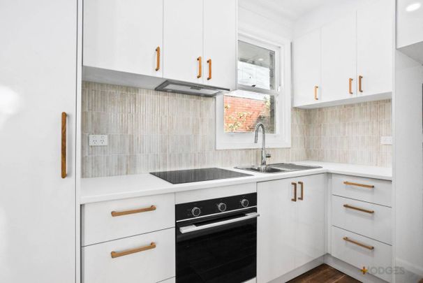 Freshly Renovated Coastal Retreat – Walk to the Beach! - Photo 1