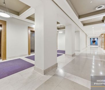 Freshly Renovated Two-Bedroom Apartment with City Views - Photo 6