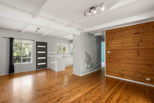 Spacious 3- Bedroom Family Home with Solar, Triple Garage & Waterfront Location - Photo 1