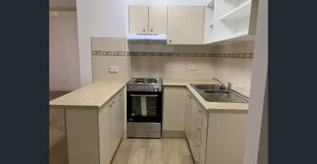 A Quiet Sanctuary Away from The Bustle of The Inner-City with New Flooring, New Paint and New Cooking Appliance. - Photo 4