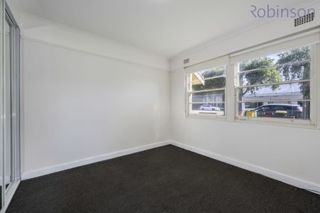 Centrally located large two bedroom unit with sun room. - Photo 4