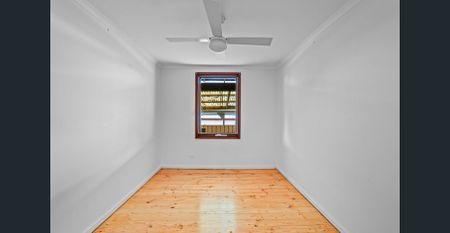 Family home with large backyard and multiple living spaces - Photo 4