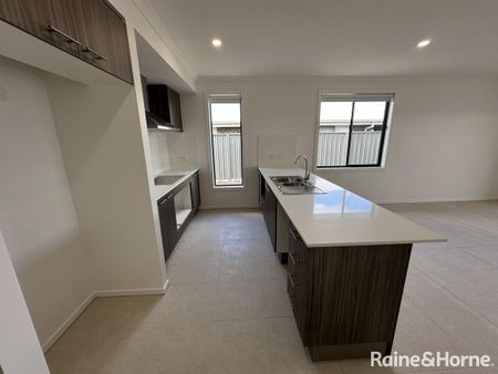 Brand New 4-Bedroom, 2-Living Family Home in Munno Para Downs - Photo 5