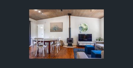 Charming Leafy Retreat - Character Home with Deck, Privacy & Style - Photo 4