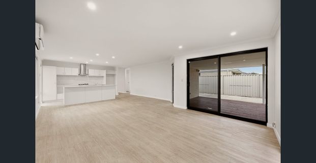 Modern Coastal Living Opposite Parklands! - Photo 1