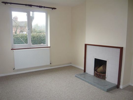 3 bedroom semi detached cottage in a semi rural position with good size surrounding gardens and garage. - Photo 1