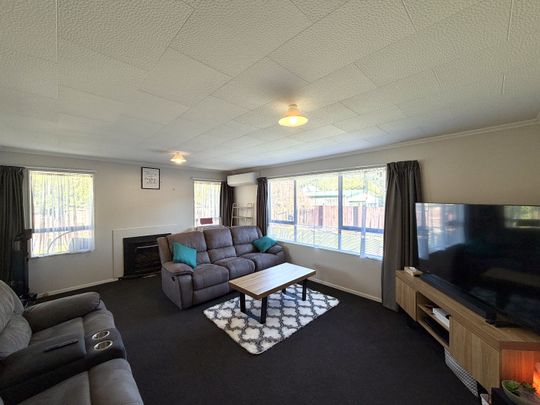 Spacious Family Home with Fully Fenced Yard! - Photo 1