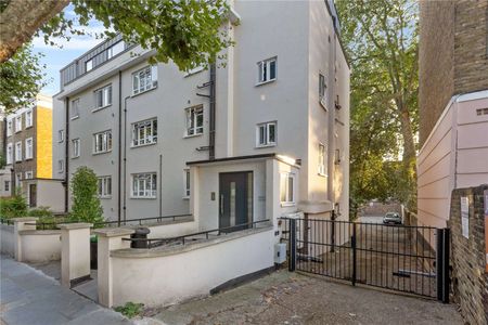 A stunning top floor apartment with wonderful light and views. A brand new two bedroom flat with wooden flooring, large windows and a balcony - Photo 3