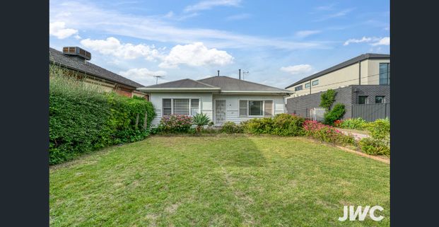 Charming Home with Spacious Layout & Established Gardens - Photo 1