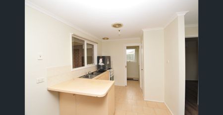 Freshly Painted with New Floors - Family Home with Extra Potential! - Photo 5