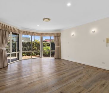 SPACIOUS FAMILY HOME WITH MULTIPLE LIVING AREAS IN COOMBABAH - Photo 1