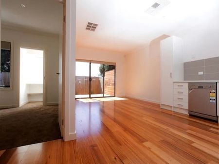 MODERN UNIT WITH PRIVATE COURTYARD AND CARPORT - Photo 3