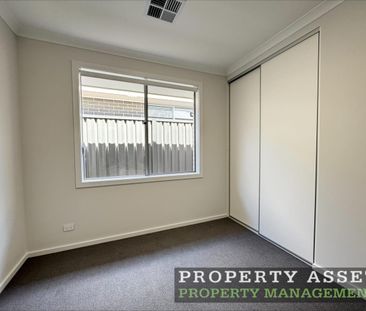 Stylish Brand-New Four Bedroom Home with Energy-Saving Solar - Photo 4