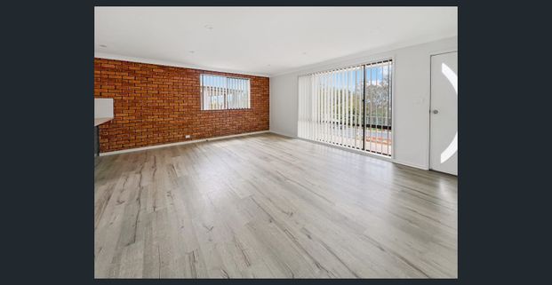 Beautifully Renovated Single-Level Coastal Apartment - Photo 1