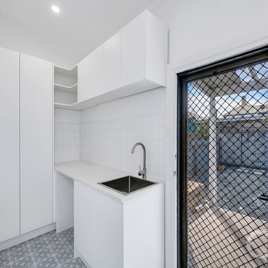 Open the Door to Coastal Charm with Modern Comfort - Photo 1