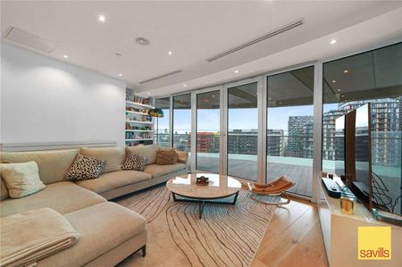 An Impressive apartment of approximately 1,348 sq ft located within just a short distance from Canary Wharf. The property comes with parking, residents gym, pool and concierge. - Photo 2