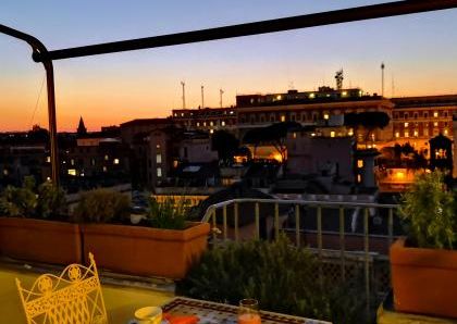 Attic-Monti: 1-6 month rentals. Spacious, furnished 3 Bedroom, 2 bath, living room, dining room, study and large panoramic terrace. Bright, silent, located in well kept Palazzo d’Epoca with elevator and doorman. Near transport and Metro.